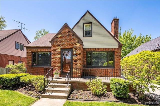 124 Allenhurst Rd, Amherst, NY 14226 - tudor-style house with brick siding and a chimney