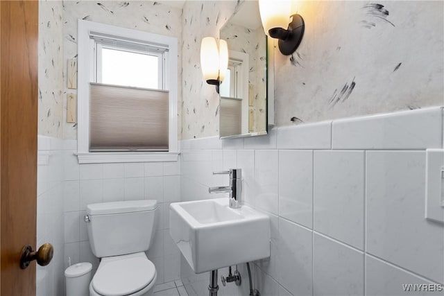 124 Allenhurst Rd, Amherst, NY 14226 - half bathroom with wallpapered walls, tile walls, and a wainscoted wall