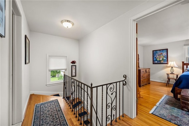 124 Allenhurst Rd, Amherst, NY 14226 - hall featuring an upstairs landing and wood finished floors