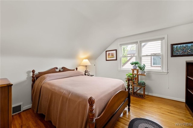 124 Allenhurst Rd, Amherst, NY 14226 - bedroom featuring wood finished floors and lofted ceiling