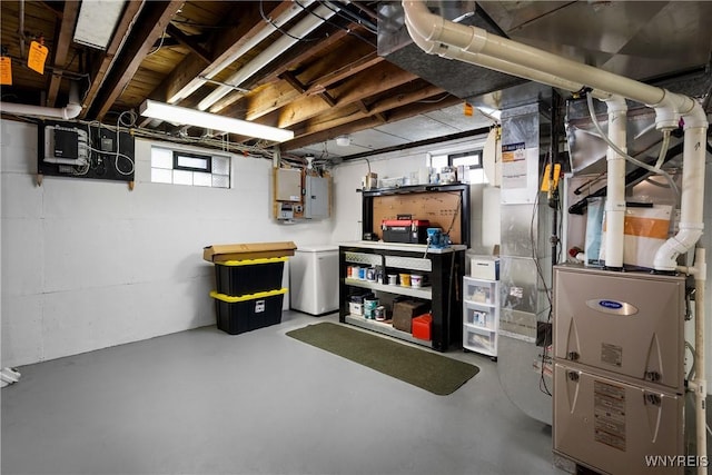 124 Allenhurst Rd, Amherst, NY 14226 - below grade area featuring electric panel, fridge, and heating unit