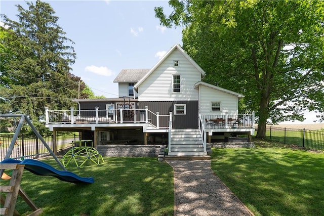 7046 Safford Ave Unit 12, Castile, NY 14530 - rear view of house featuring a fenced backyard, a deck, a playground, and stairway