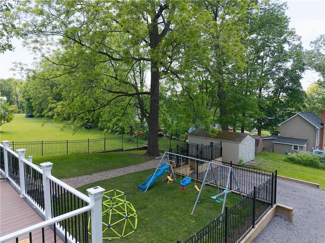 7046 Safford Ave Unit 12, Castile, NY 14530 - fenced backyard with a playground and a storage unit