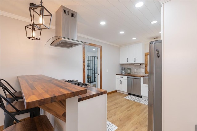 7046 Safford Ave Unit 12, Castile, NY 14530 - kitchen featuring butcher block countertops, stainless steel appliances, island exhaust hood, recessed lighting, and white cabinets