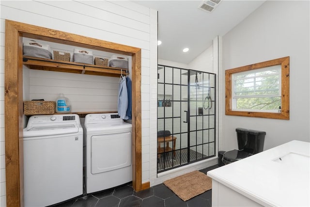 7046 Safford Ave Unit 12, Castile, NY 14530 - washroom featuring independent washer and dryer, dark tile patterned floors, and recessed lighting