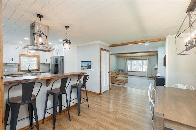 7046 Safford Ave Unit 12, Castile, NY 14530 - kitchen featuring freestanding refrigerator, butcher block countertops, white cabinetry, light wood-style floors, and recessed lighting