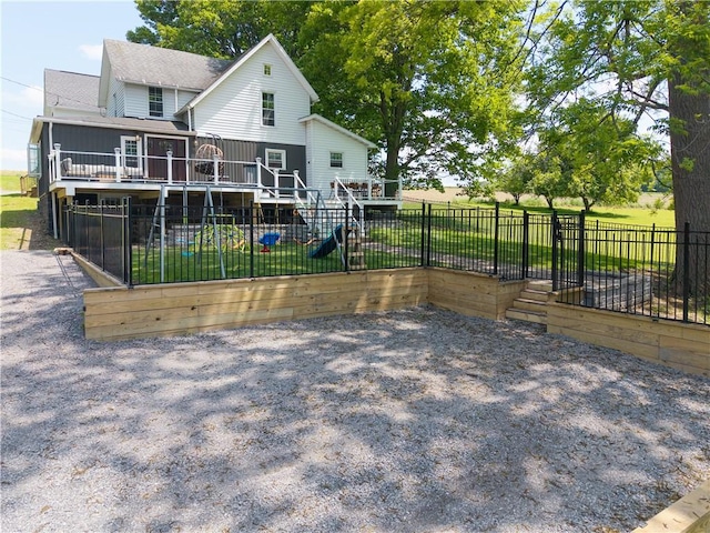 7046 Safford Ave Unit 12, Castile, NY 14530 - view of front of property with a deck, a fenced backyard, roof with shingles, and stairway