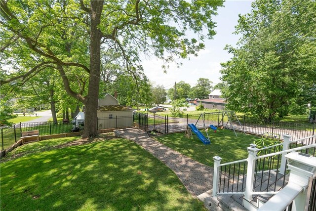 7046 Safford Ave Unit 12, Castile, NY 14530 - fenced backyard featuring a playground