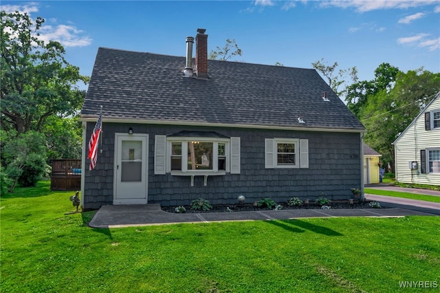 4306 Shimerville Rd, Clarence, NY 14031 - rear view of house with a shingled roof, a chimney, and a lawn