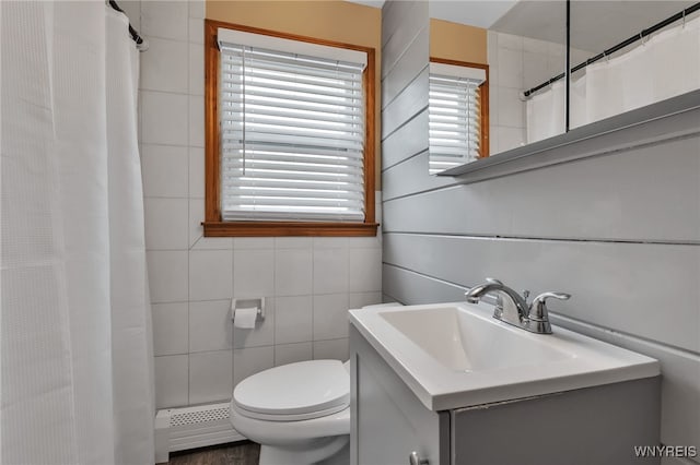 4306 Shimerville Rd, Clarence, NY 14031 - bathroom with baseboard heating, vanity, a shower with curtain, and tile walls