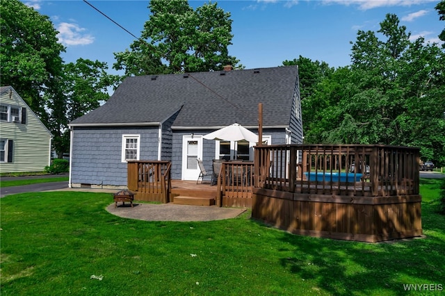 4306 Shimerville Rd, Clarence, NY 14031 - back of property featuring roof with shingles, a wooden deck, and a yard