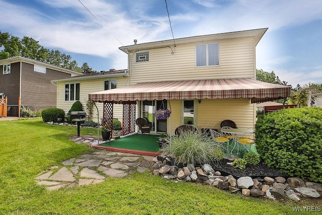 48 Kibler Dr, Lancaster, NY 14043 - back of house featuring a yard and a patio