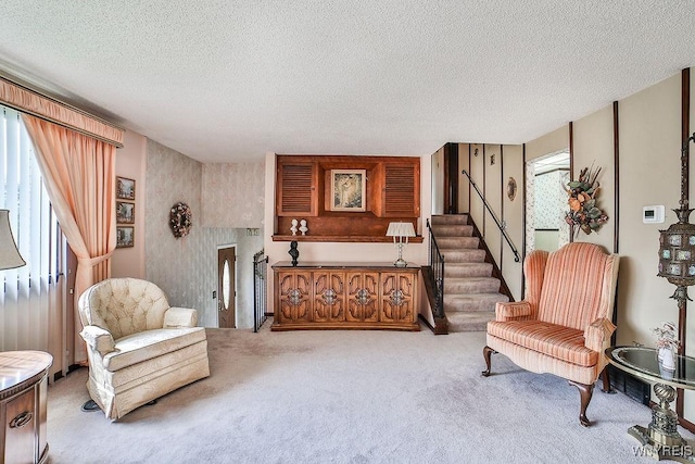 48 Kibler Dr, Lancaster, NY 14043 - living room featuring carpet floors, a textured ceiling, and stairs