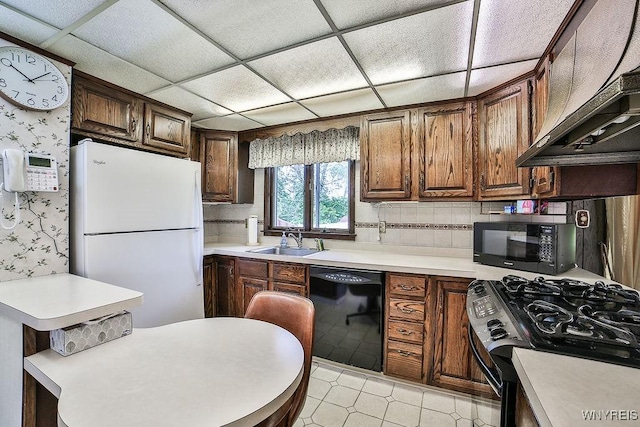48 Kibler Dr, Lancaster, NY 14043 - kitchen with black appliances, light countertops, wallpapered walls, a paneled ceiling, and wall chimney range hood