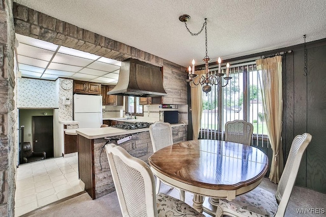 48 Kibler Dr, Lancaster, NY 14043 - dining room featuring a chandelier, wallpapered walls, and light carpet