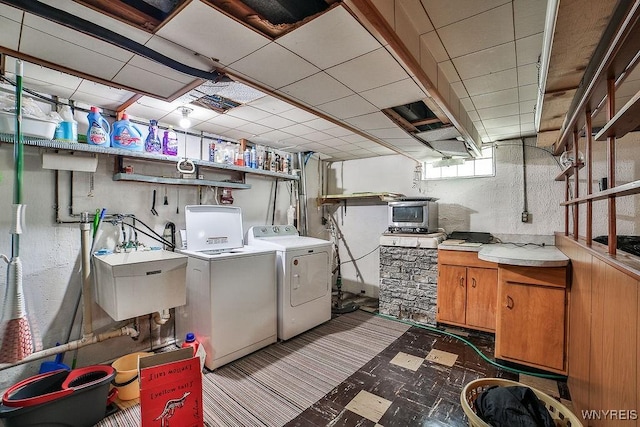 48 Kibler Dr, Lancaster, NY 14043 - washroom featuring washer and clothes dryer, cabinet space, and tile patterned floors