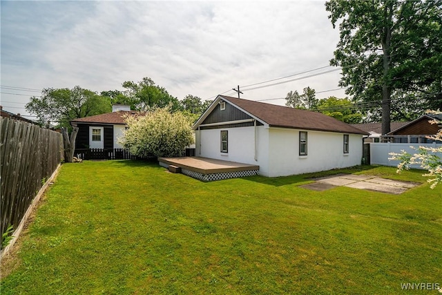482 Loretta St, Tonawanda-Town, NY 14223 - rear view of property featuring a fenced backyard, a deck, stucco siding, and a patio
