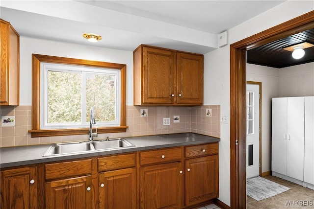 482 Loretta St, Tonawanda-Town, NY 14223 - kitchen with brown cabinetry and decorative backsplash