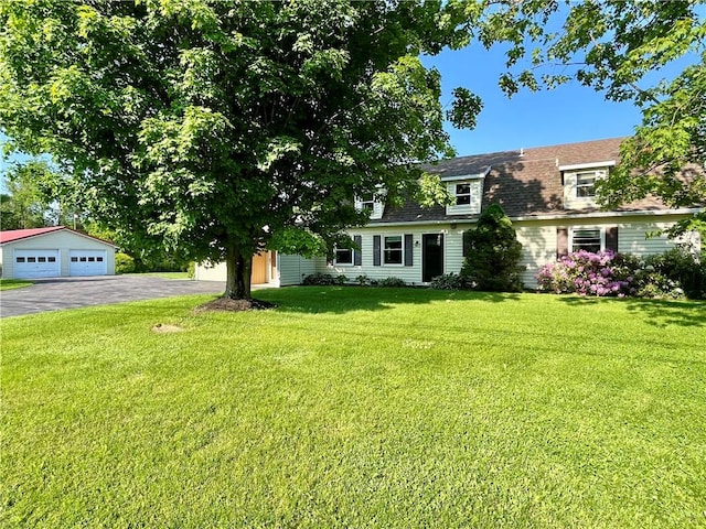 6796 E Port Bay Rd, Wolcott, NY 14590 - view of front of home featuring a front yard, a shingled roof, and a detached garage