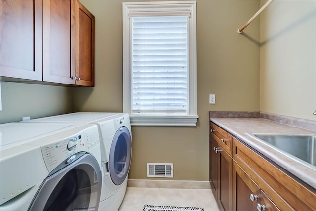 393 Mendon Center Rd, Mendon, NY 14472 - laundry room with cabinet space, independent washer and dryer, and light tile patterned flooring