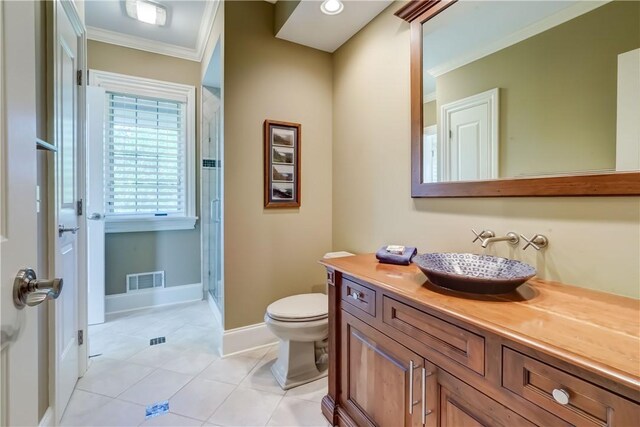 393 Mendon Center Rd, Mendon, NY 14472 - bathroom featuring crown molding, vanity, tile patterned flooring, and a shower