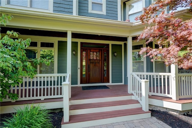 393 Mendon Center Rd, Mendon, NY 14472 - view of exterior entry featuring a porch