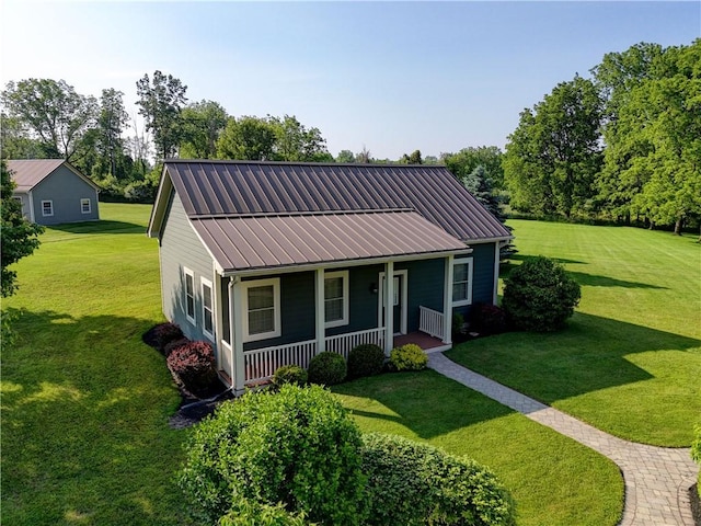 393 Mendon Center Rd, Mendon, NY 14472 - view of front of house with a porch, a front yard, and a metal roof