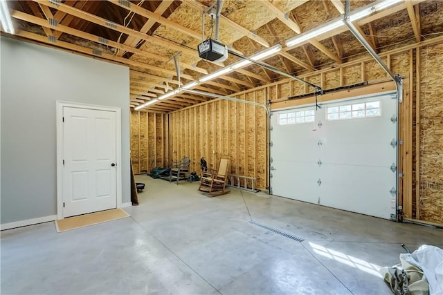 393 Mendon Center Rd, Mendon, NY 14472 - garage featuring a garage door opener