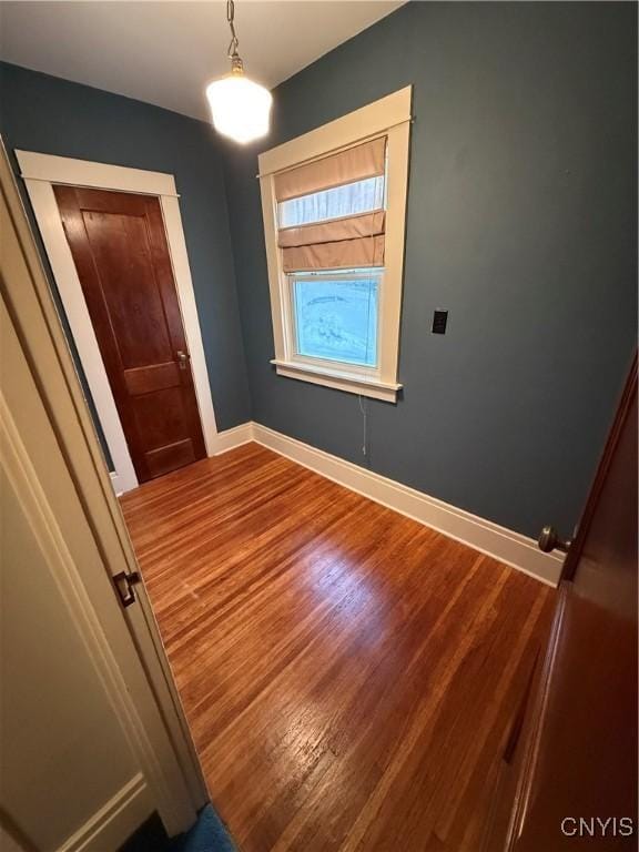 24 Van Vorst St, Utica, NY 13501 - empty room with wood finished floors