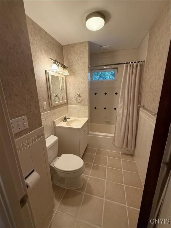 24 Van Vorst St, Utica, NY 13501 - full bathroom with tile patterned floors, vanity, shower / tub combo with curtain, and tile walls