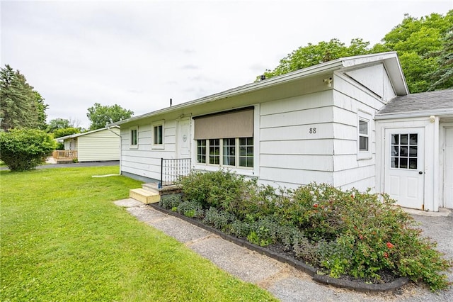 88 Rouge Rd, Henrietta, NY 14623 - view of side of property with a lawn