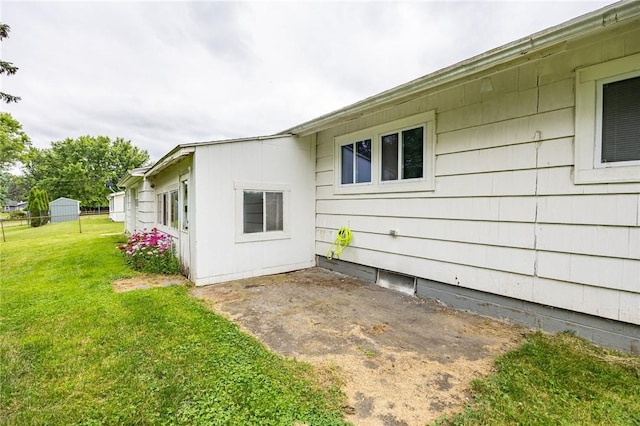 88 Rouge Rd, Henrietta, NY 14623 - view of property exterior featuring a yard and a patio area