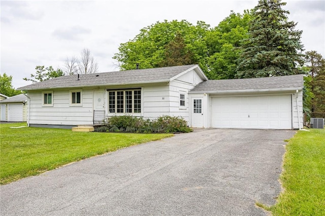 88 Rouge Rd, Henrietta, NY 14623 - ranch-style house featuring a front yard, asphalt driveway, and an attached garage