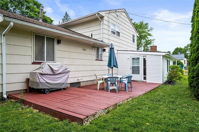 217 Red Lion Rd, Henrietta, NY 14467 - wooden terrace with outdoor dining area, a lawn, and grilling area
