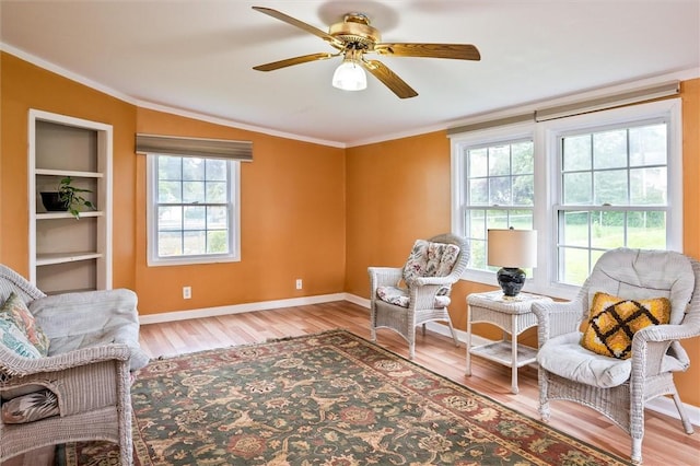 217 Red Lion Rd, Henrietta, NY 14467 - sitting room featuring wood finished floors, a ceiling fan, and ornamental molding