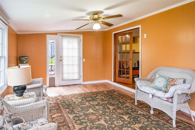 217 Red Lion Rd, Henrietta, NY 14467 - living area featuring ceiling fan, wood finished floors, and ornamental molding