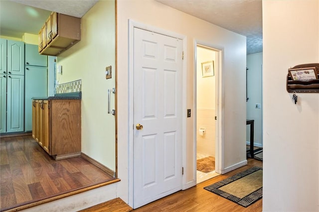 217 Red Lion Rd, Henrietta, NY 14467 - corridor with dark wood finished floors and a textured ceiling