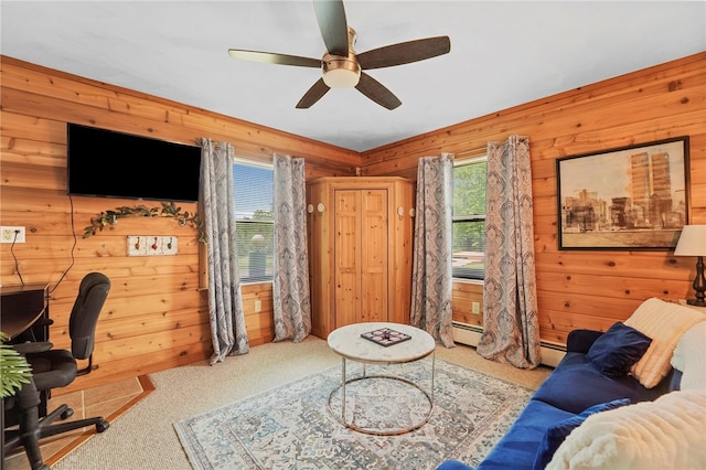 474 Thorpe Rd, Sidney, NY 13838 - carpeted living room featuring wood walls, a ceiling fan, a desk, and a baseboard heating unit