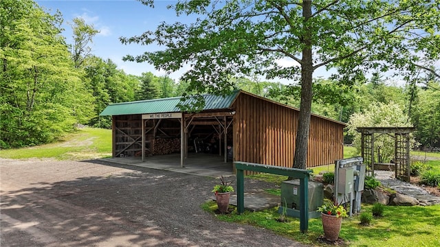 474 Thorpe Rd, Sidney, NY 13838 - view of pole building with a carport, dirt driveway, and a forest view