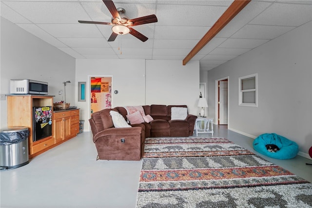 474 Thorpe Rd, Sidney, NY 13838 - living room with a ceiling fan, a drop ceiling, and concrete floors