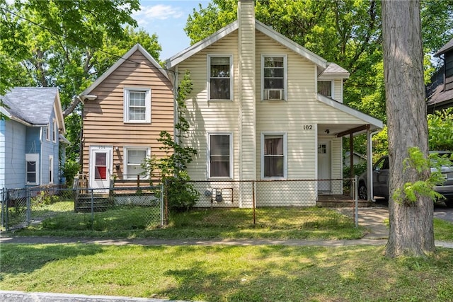 102 Cottage St, Rochester, NY 14608 - rear view of house featuring a fenced front yard, a chimney, and covered porch