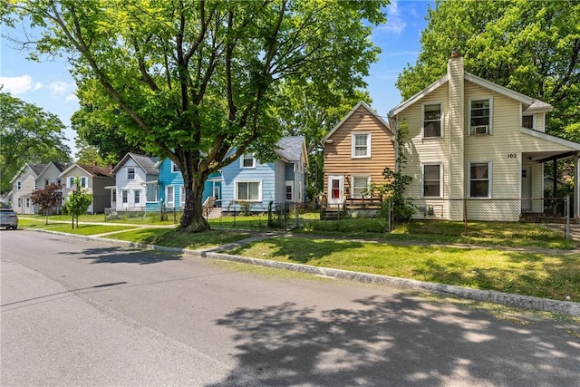 102 Cottage St, Rochester, NY 14608 - view of front of house with a chimney and a residential view