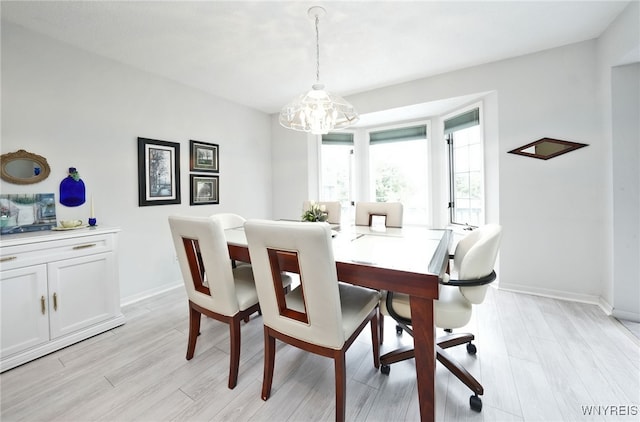 2850 Amsdell Rd Unit 30, Hamburg, NY 14075 - dining space featuring light wood-type flooring and a chandelier