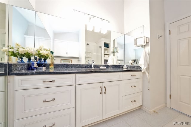 2850 Amsdell Rd Unit 30, Hamburg, NY 14075 - full bathroom featuring lofted ceiling, vanity, tile patterned floors, and a shower with shower door