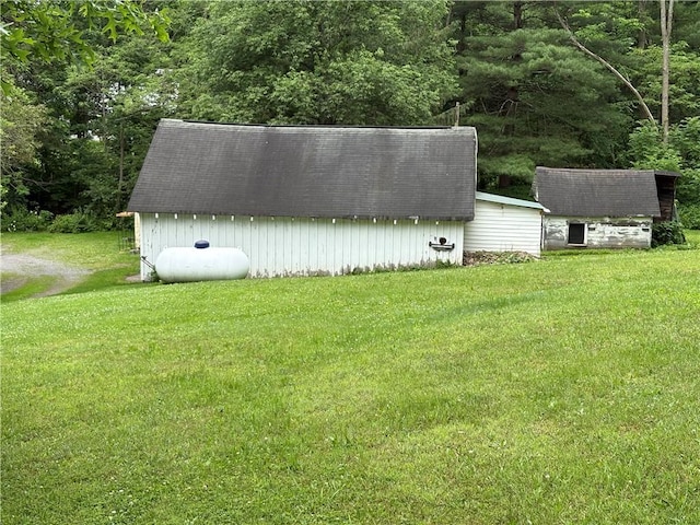 839 State Highway 7, Unadilla, NY 13849 - view of grassy yard with a storage unit and a forest view