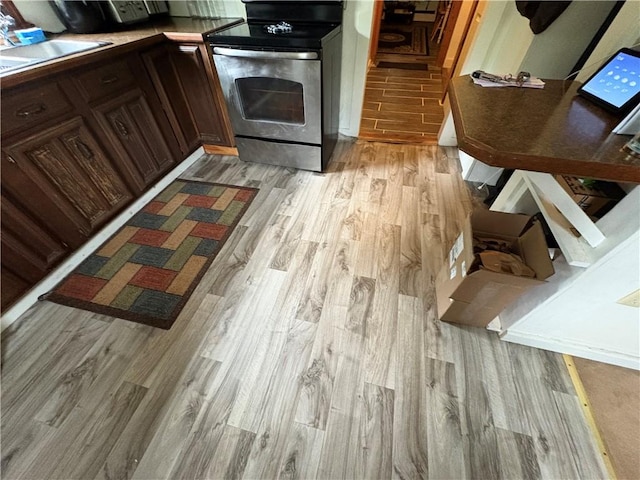 839 State Highway 7, Unadilla, NY 13849 - kitchen with stainless steel range with electric cooktop and light wood finished floors