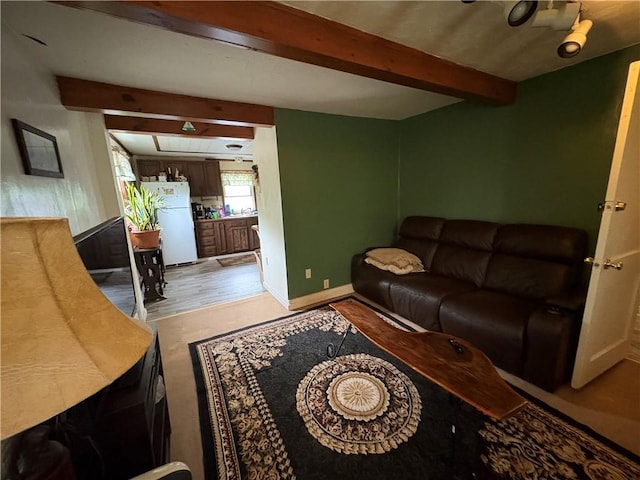 839 State Highway 7, Unadilla, NY 13849 - living room featuring beamed ceiling and light wood-type flooring