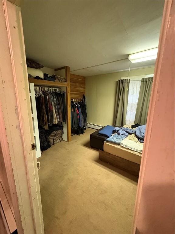 839 State Highway 7, Unadilla, NY 13849 - carpeted bedroom featuring a baseboard heating unit