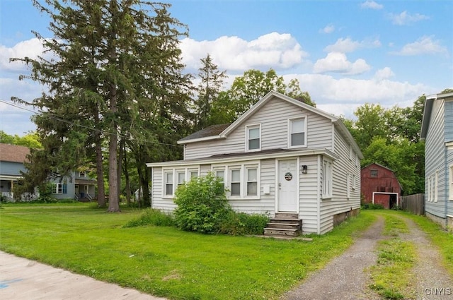 16 Meadow St, Kirkland, NY 13323 - traditional-style home featuring entry steps, a front yard, driveway, an outbuilding, and a barn