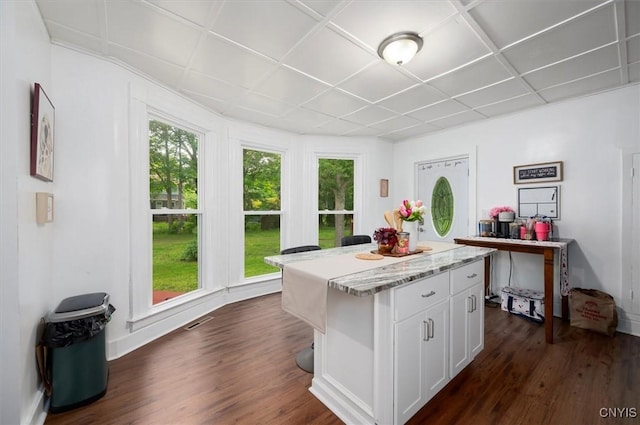 16 Meadow St, Kirkland, NY 13323 - kitchen with white cabinetry, a kitchen island, dark wood-style floors, and light stone counters